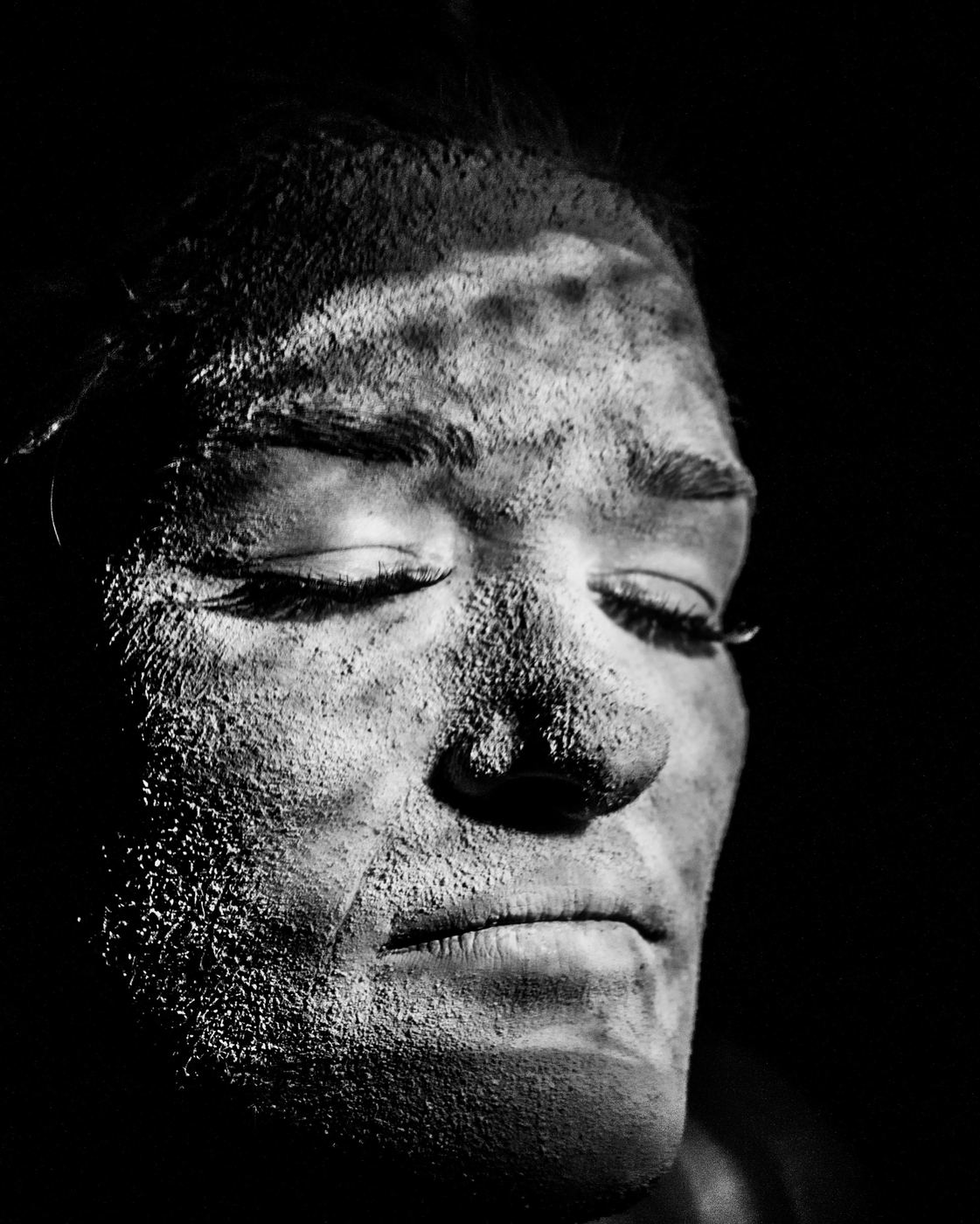 Black and white face covered in powder