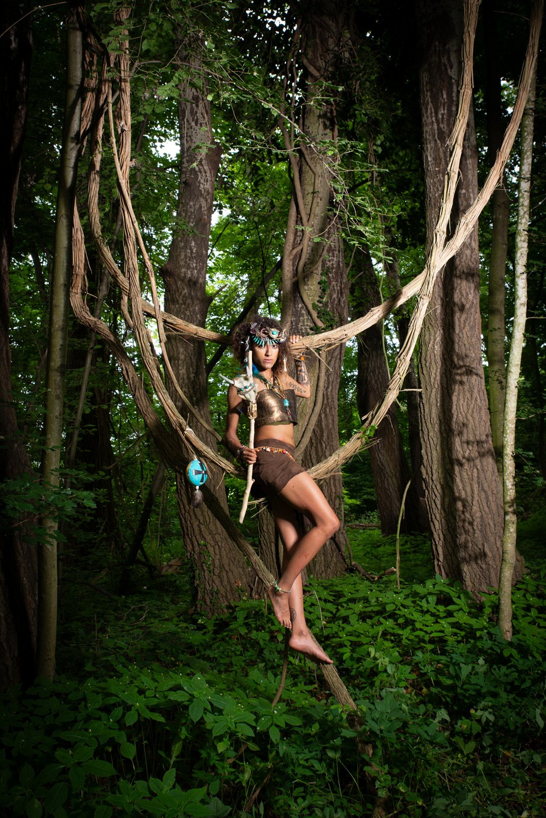 Forest warrior woman among the vines